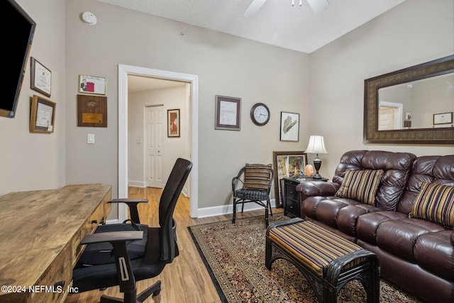 office space with ceiling fan and wood-type flooring