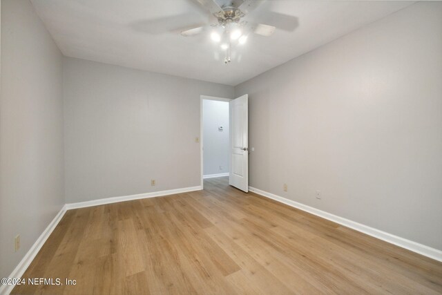 spare room featuring ceiling fan and light wood-type flooring