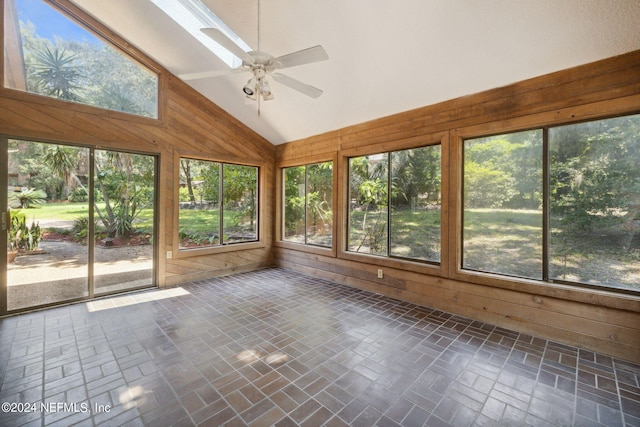 unfurnished sunroom featuring vaulted ceiling and ceiling fan