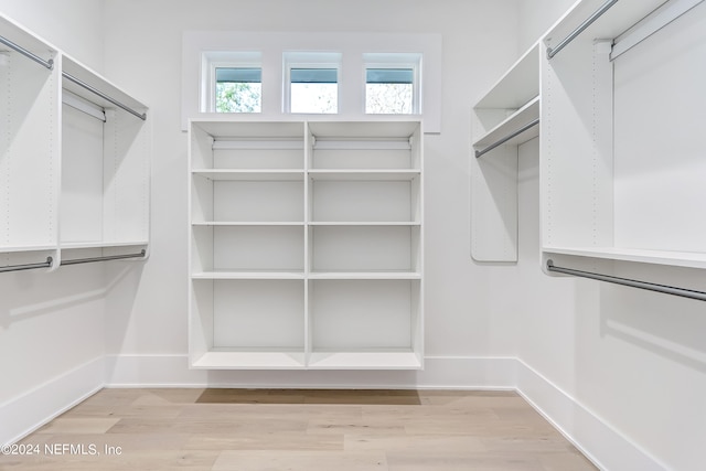 walk in closet featuring light hardwood / wood-style floors