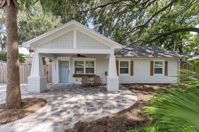 view of front of property with ceiling fan and a porch