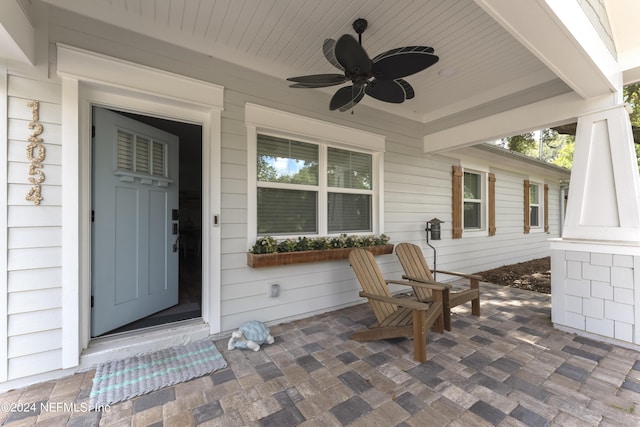 property entrance with ceiling fan