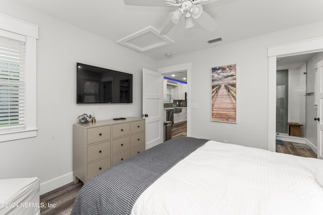 bedroom featuring ceiling fan, dark hardwood / wood-style flooring, and sink