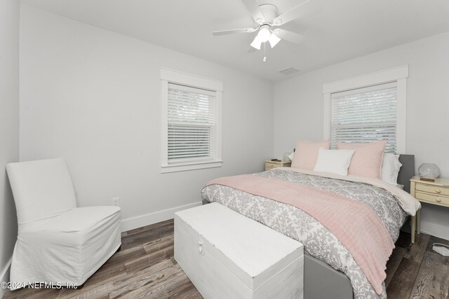 bedroom featuring ceiling fan and dark wood-type flooring