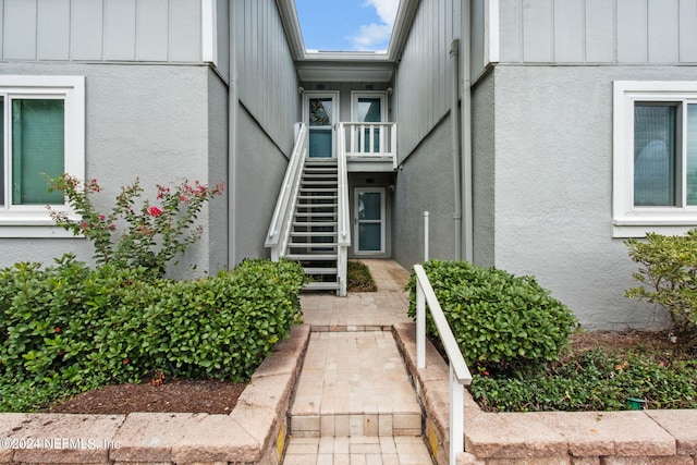 doorway to property featuring board and batten siding