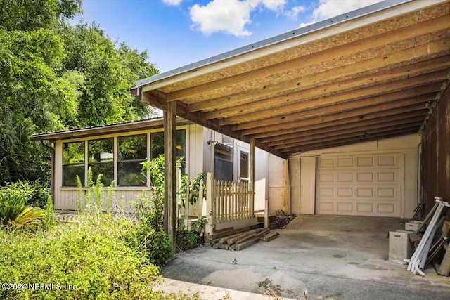 exterior space featuring a garage and a carport