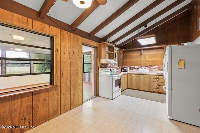 kitchen with white appliances, a healthy amount of sunlight, and light tile floors