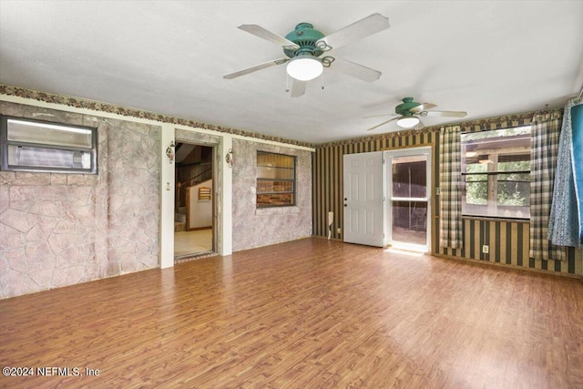 spare room featuring hardwood / wood-style flooring and ceiling fan