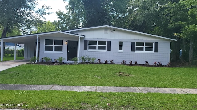 ranch-style home with a carport and a front yard