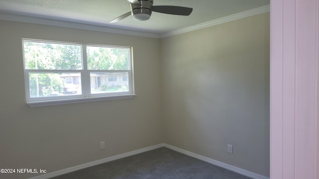 carpeted empty room with ceiling fan and crown molding