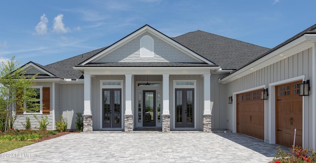 view of front of house with french doors and a garage