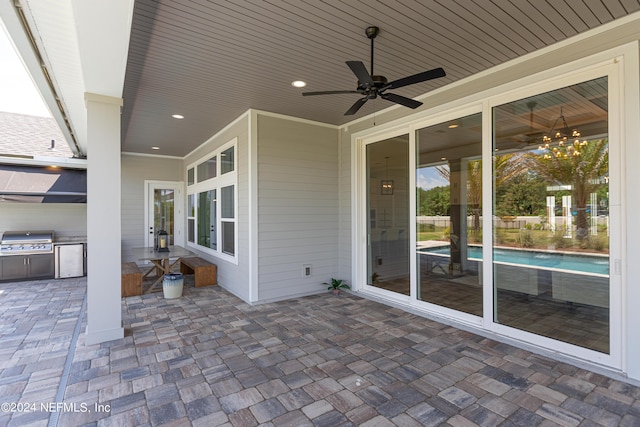 view of patio featuring area for grilling and ceiling fan