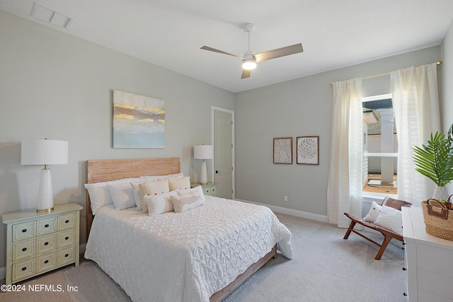 carpeted bedroom featuring ceiling fan