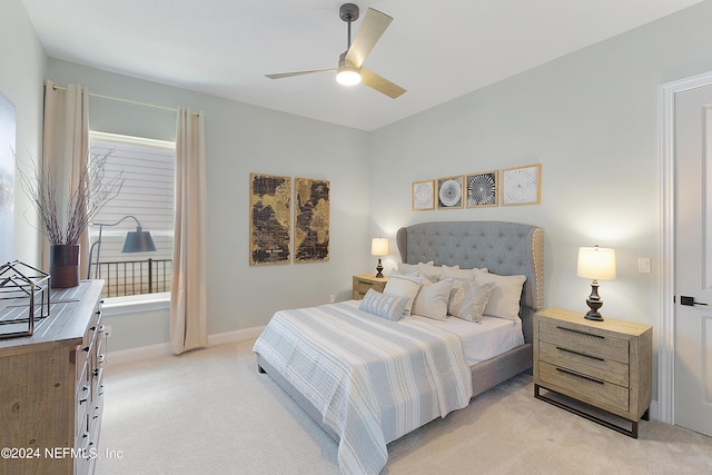 bedroom featuring ceiling fan and light colored carpet