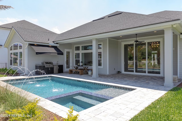 view of swimming pool featuring pool water feature, ceiling fan, an in ground hot tub, area for grilling, and a patio area