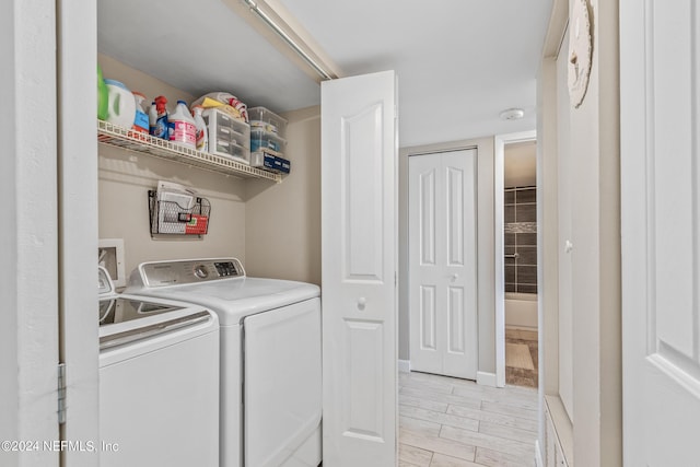 clothes washing area with independent washer and dryer