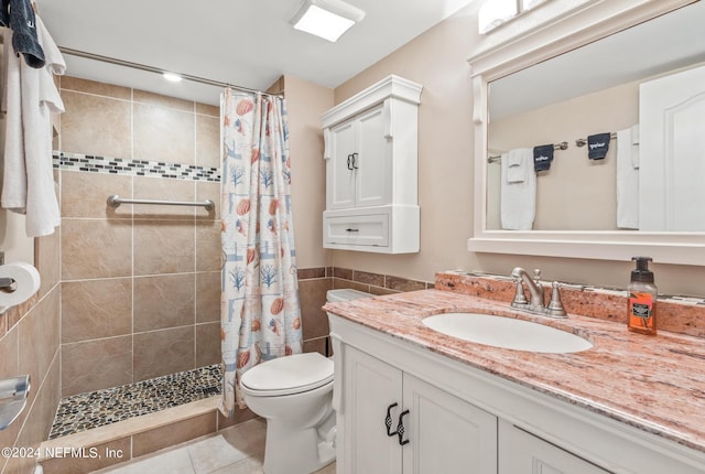 bathroom featuring tile patterned flooring, vanity, toilet, and a shower with shower curtain