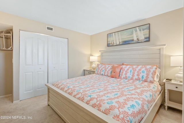 carpeted bedroom with a closet