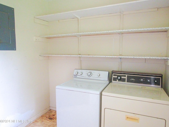 washroom featuring independent washer and dryer and electric panel