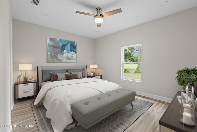 bedroom featuring light hardwood / wood-style flooring and ceiling fan