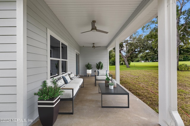 view of patio with an outdoor living space and ceiling fan