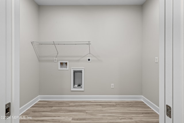 washroom with light wood-style floors, laundry area, hookup for an electric dryer, and baseboards