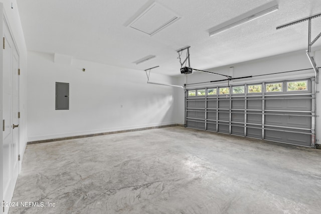 garage featuring a garage door opener and electric panel