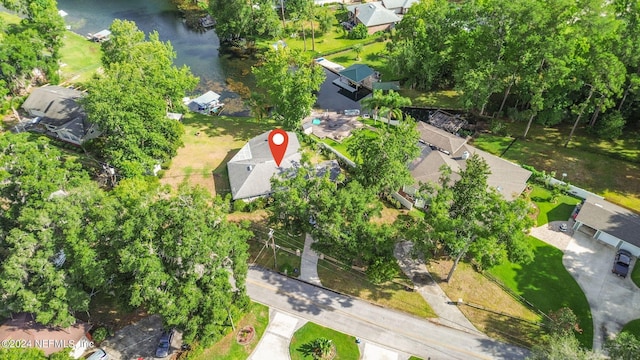 birds eye view of property featuring a water view and a residential view