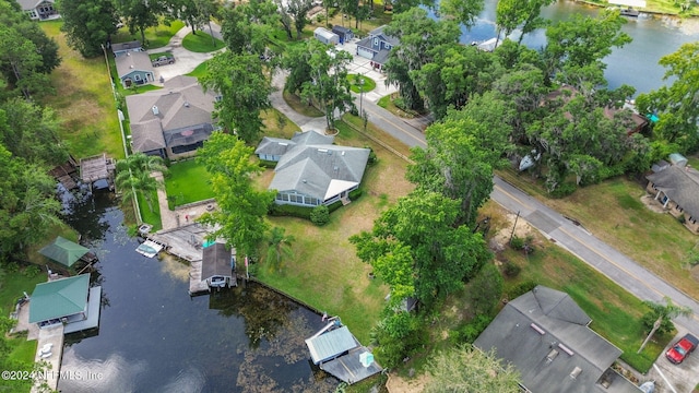 drone / aerial view featuring a residential view and a water view