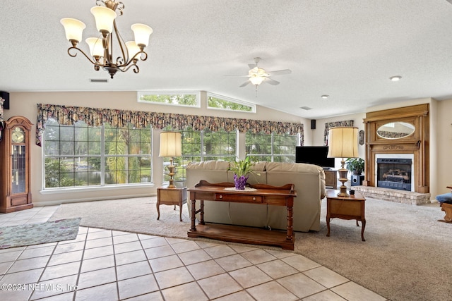 living room featuring light tile patterned floors, light carpet, a fireplace, visible vents, and vaulted ceiling