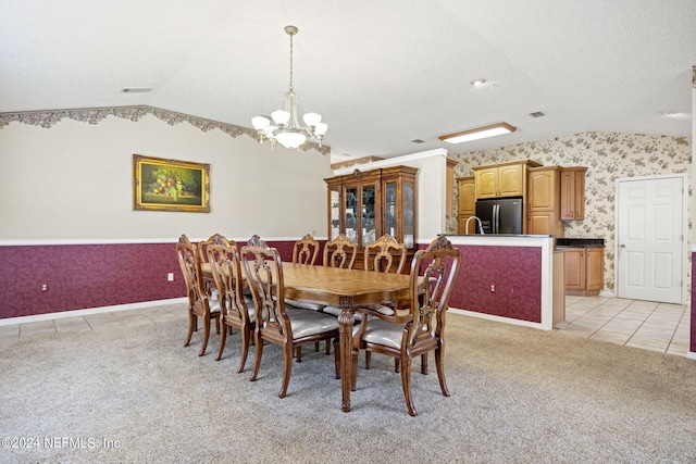 dining area featuring light tile patterned floors, lofted ceiling, light carpet, visible vents, and wallpapered walls