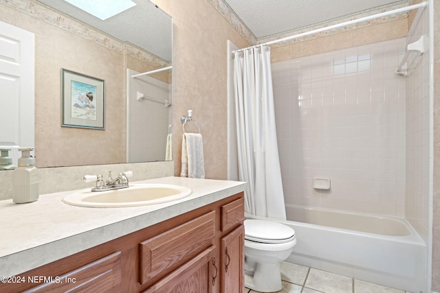 full bathroom with a textured ceiling, tile patterned flooring, toilet, vanity, and shower / bathtub combination with curtain