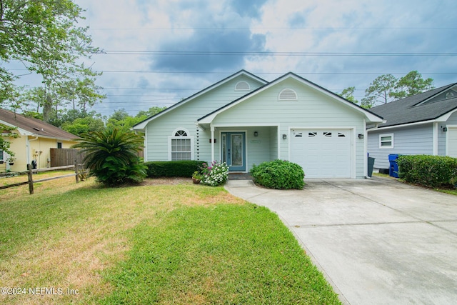 single story home with a garage and a front lawn