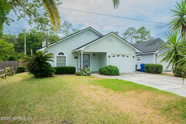 view of front of house featuring a front yard and a garage