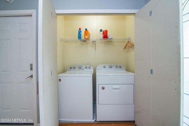 clothes washing area with independent washer and dryer