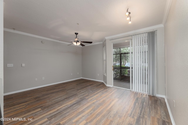 empty room featuring ornamental molding, dark hardwood / wood-style floors, and ceiling fan