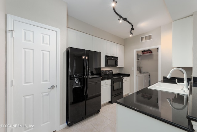 kitchen featuring white cabinetry, black appliances, rail lighting, sink, and light tile flooring