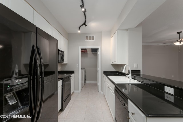 kitchen featuring black appliances, white cabinetry, light tile floors, and rail lighting