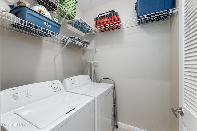 laundry area with separate washer and dryer