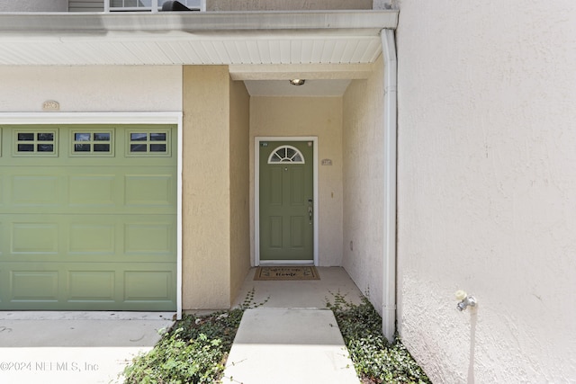 entrance to property featuring a garage