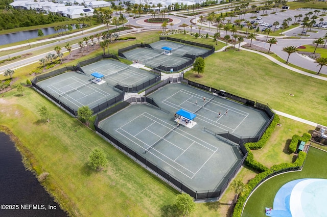 birds eye view of property with a water view