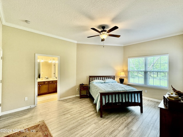 bedroom featuring light wood-type flooring, connected bathroom, ceiling fan, and crown molding