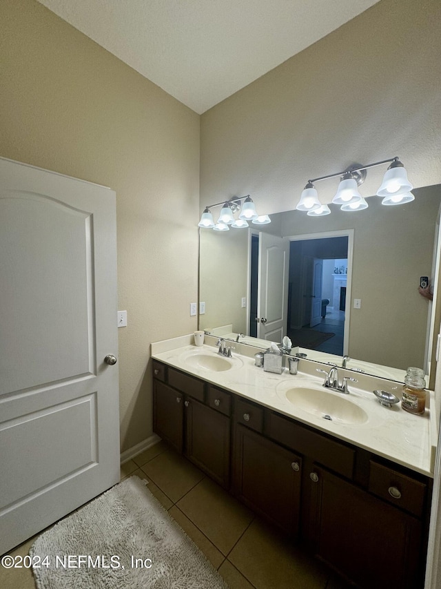 bathroom featuring tile patterned flooring and vanity