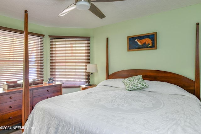 bedroom featuring a textured ceiling and ceiling fan