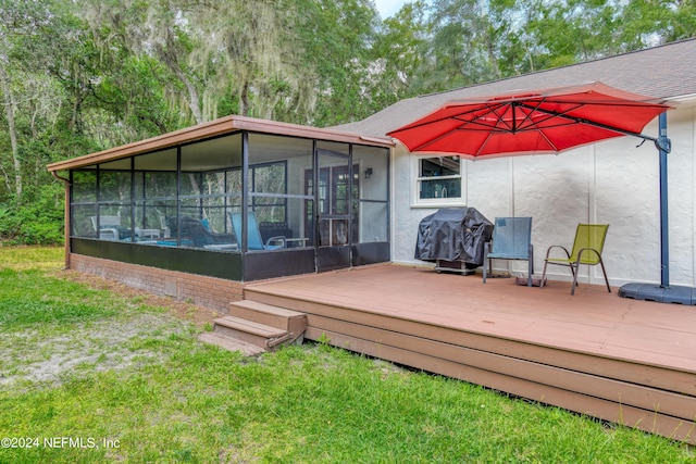 exterior space with a deck and a sunroom