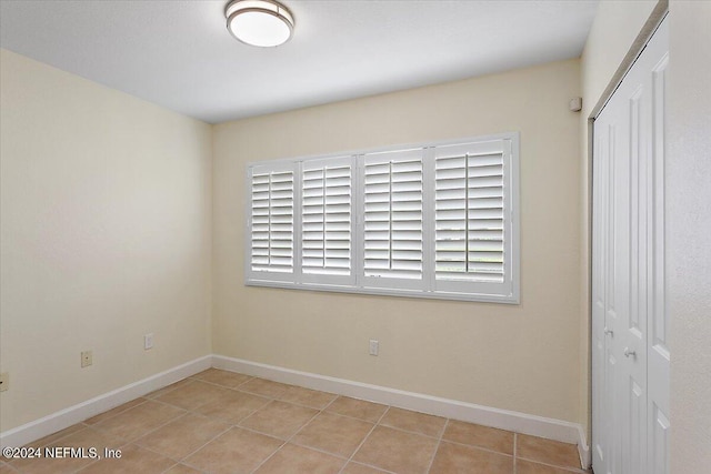 view of tiled spare room