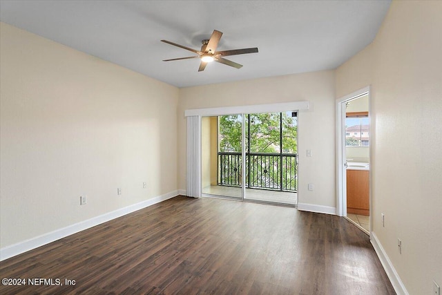 empty room featuring ceiling fan and dark hardwood / wood-style floors