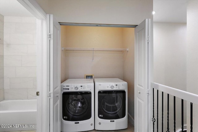 washroom with independent washer and dryer