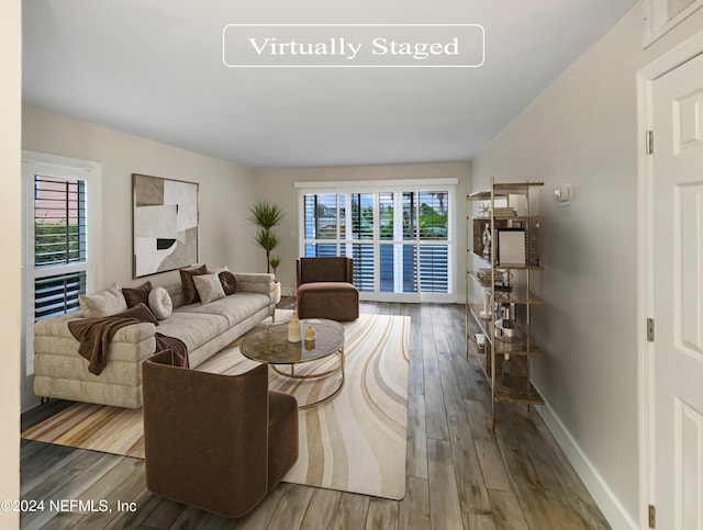 6300 A1A S Unit A74D, Saint Augustine, FL 32080 - living room with plenty of natural light and hardwood / wood-style floors