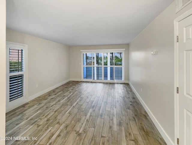 6300 A1A S Unit A74D, Saint Augustine, FL 32080 - spare room featuring wood finished floors and plenty of natural light